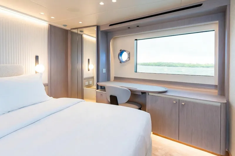 Slide: The Image of Luxurious interior of 2026 Absolute NAVETTA 70 yacht with elegant cabinetry and large window. - 54