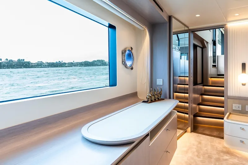 Slide: The Image of Interior staircase of 2026 Absolute NAVETTA 70 yacht, featuring modern design and ambient lighting. - 57