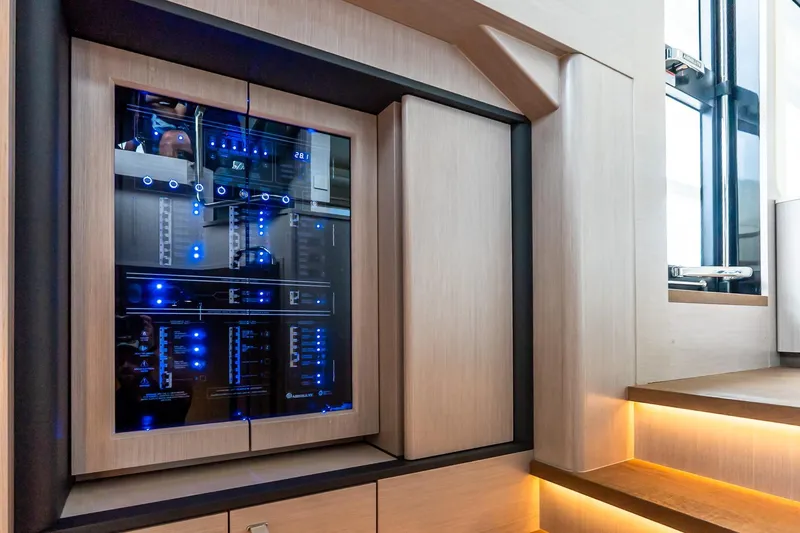 Slide: The Image of Electrical control panel with blue LED lights on Absolute NAVETTA 70 yacht, 2026 model. - 58
