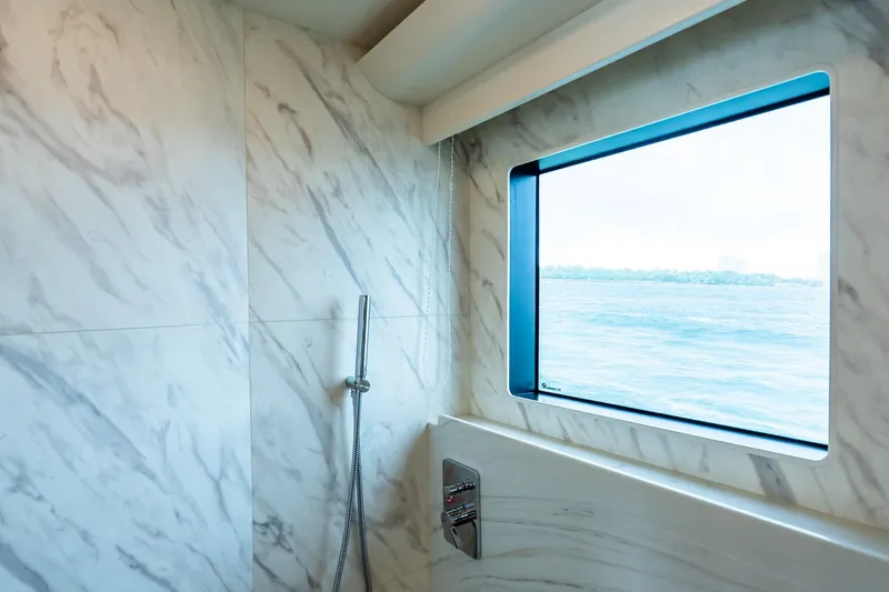 Slide: The Image of Luxurious bedroom interior on Absolute NAVETTA 70 yacht, 2026 model, featuring modern design. - 63
