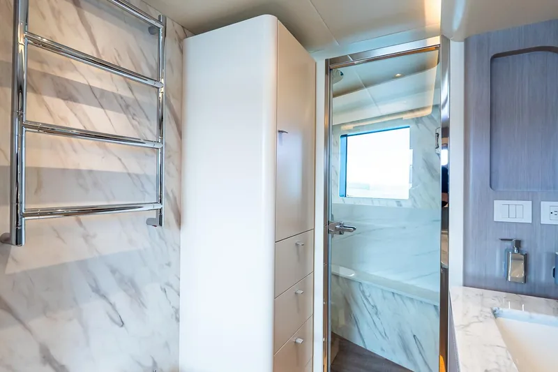 Slide: The Image of Luxurious bedroom interior on Absolute NAVETTA 70 yacht, 2026 model, featuring modern design elements. - 64