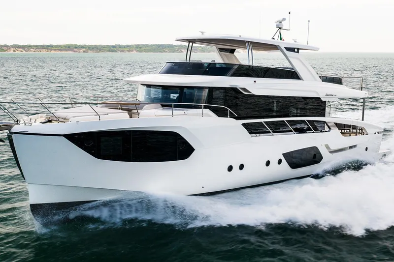 Slide: The Image of Luxurious 2027 Absolute Navetta 70 yacht cruising on open water. - 7
