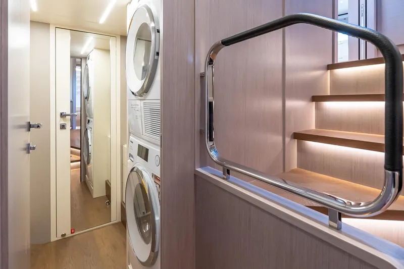 Slide: The Image of Interior of 2026 Absolute NAVETTA 70 yacht cabin with twin beds and TV. - 76