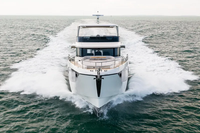 Slide: The Image of Luxurious 2026 Absolute NAVETTA 70 yacht deck with elegant seating and ocean view. - 8