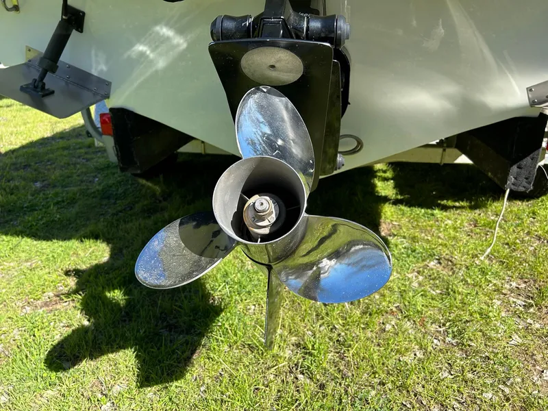 Slide: The Image of Propeller of a 2002 Baja 232 boat on grass, close-up view. - 23