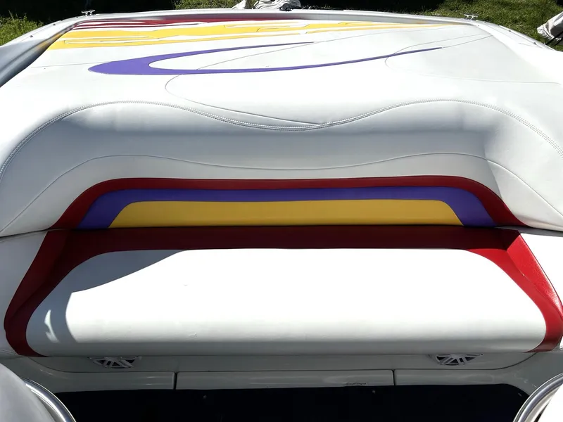 Slide: The Image of 2002 Baja 232 boat interior with colorful upholstery design. - 33