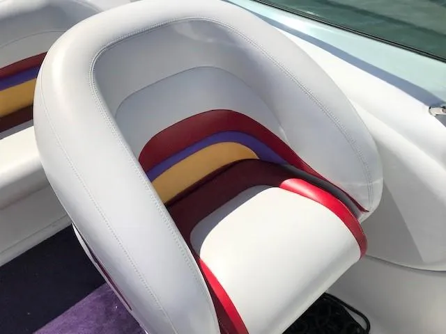 Slide: The Image of 2002 Baja 232 boat seat with colorful upholstery design. - 38