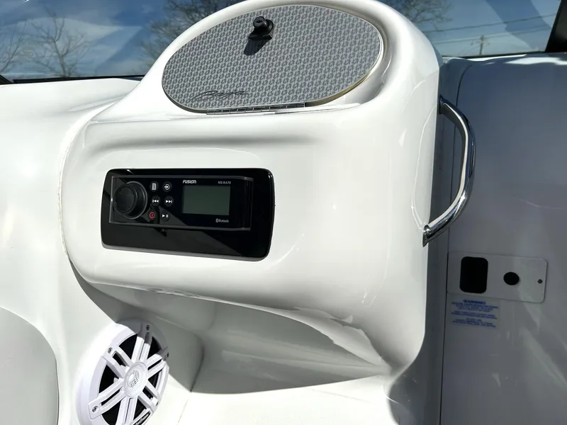 Slide: The Image of 2002 Baja 232 boat dashboard with Fusion stereo and speaker system. - 40