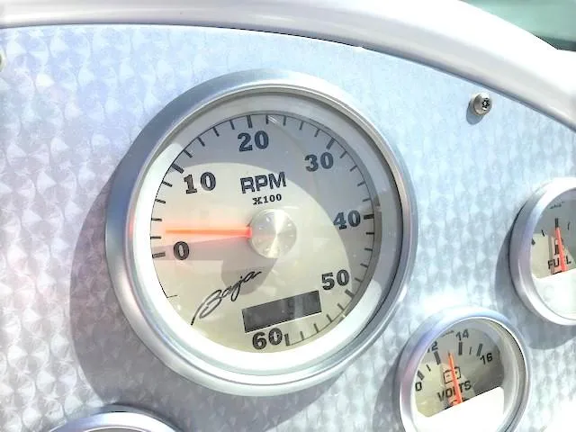 Slide: The Image of Tachometer of a 2002 Baja 232 boat, displaying RPM and other gauges. - 45