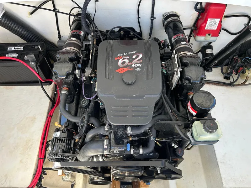 Slide: The Image of MerCruiser 6.2 MPI engine in a 2002 Baja 232 boat, detailed view. - 49