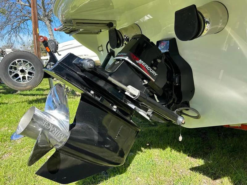 Slide: The Image of Rear view of a 2002 Baja 232 boat with a Mercury outboard motor. - 5
