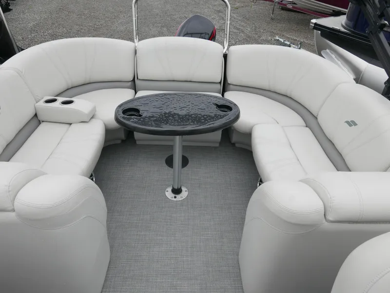 Slide: The Image of 2017 Starcraft SLS3 boat interior with white seating and a central table. - 10