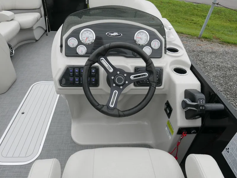 Slide: The Image of 2017 Starcraft SLS3 boat dashboard with steering wheel and control panel. - 9