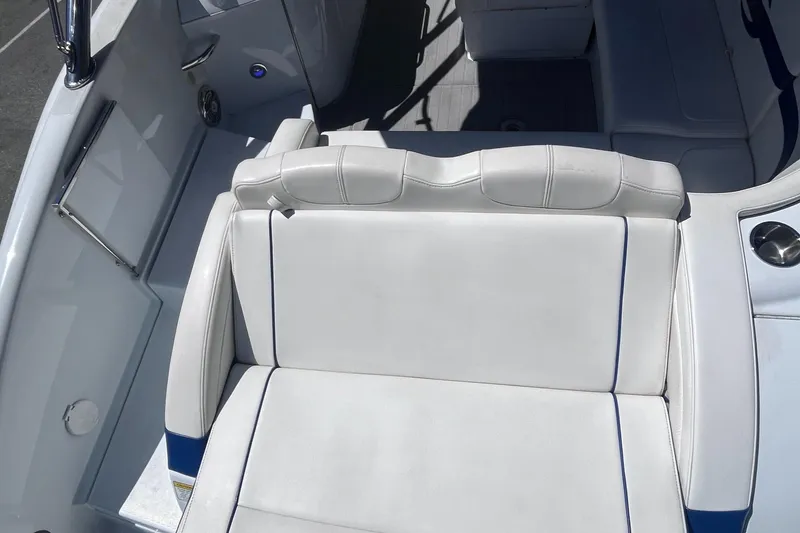 Slide: The Image of 2008 Formula 310 Bowrider boat interior with white cushioned seating. - 10
