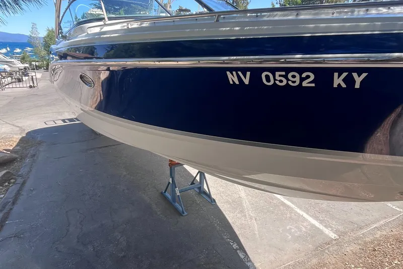Slide: The Image of 2008 Formula 310 Bowrider boat on stand, registration NV 0592 KY, dockside view. - 5