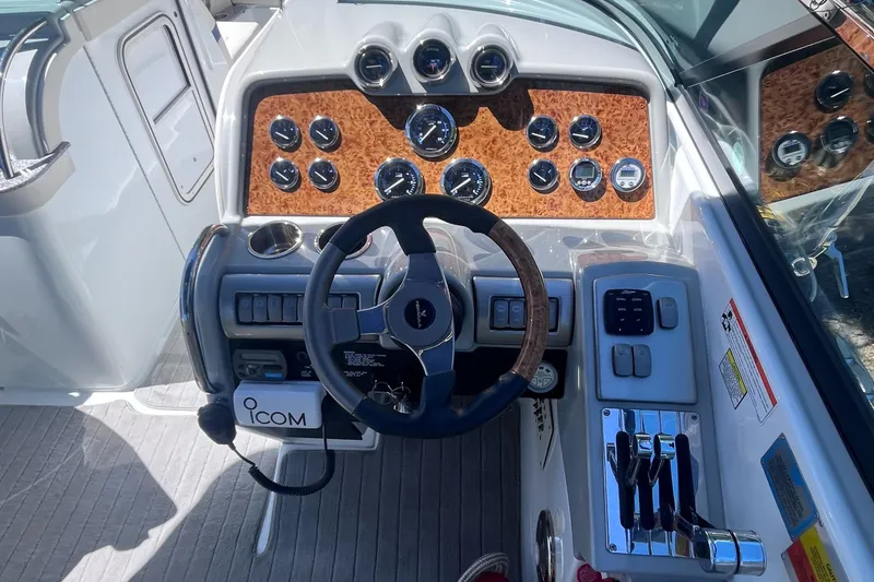Slide: The Image of 2008 Formula 310 Bowrider dashboard with steering wheel and control panel. - 6
