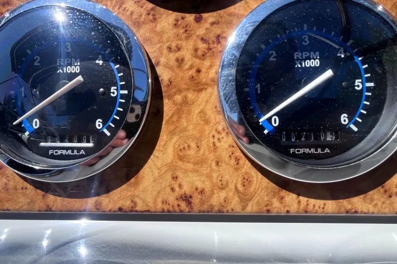 Slide: The Image of Close-up of 2008 Formula 310 Bowrider RPM gauges on a wooden dashboard. - 7