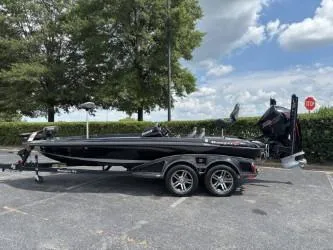 The Image of 2021 Ranger Z520C Ranger Cup Equipped boat on trailer, parked outdoors. - 0