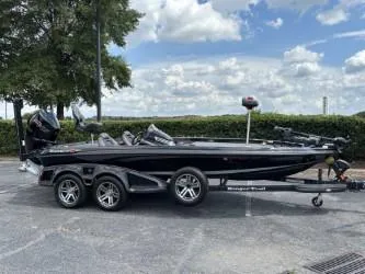 Slide: The Image of 2021 Ranger Z520C Ranger Cup Equipped boat on trailer, parked outdoors. - 2