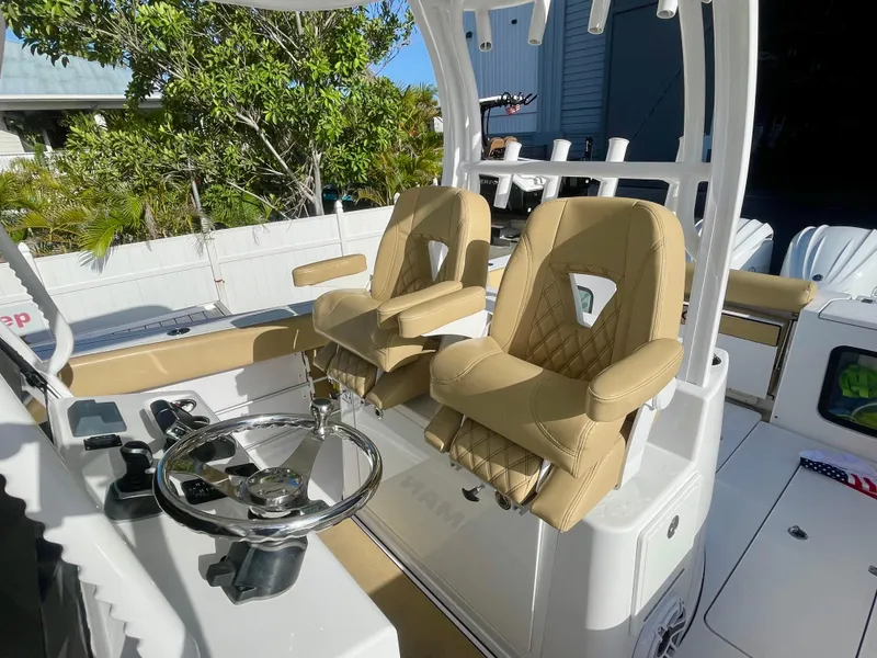Slide: The Image of Luxury seating on 2021 Sportsman 302 OPEN boat, featuring tan leather and modern design. - 17