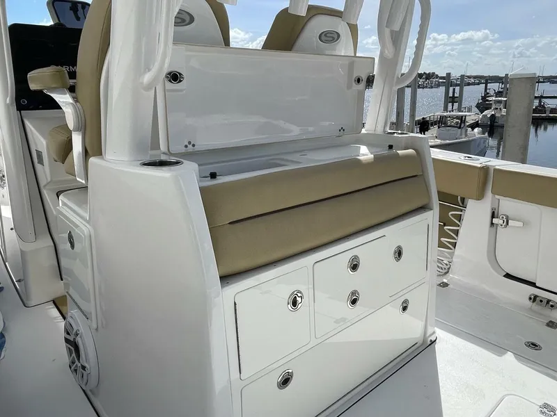 Slide: The Image of 2021 Sportsman 302 OPEN boat interior with seating and storage compartments. - 23
