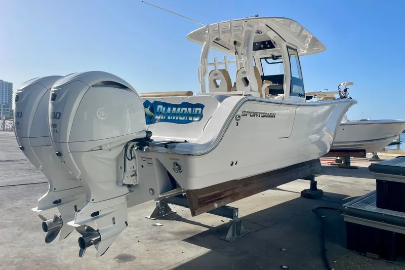 Slide: The Image of 2021 Sportsman 302 OPEN boat with dual Yamaha engines on a dock. - 26