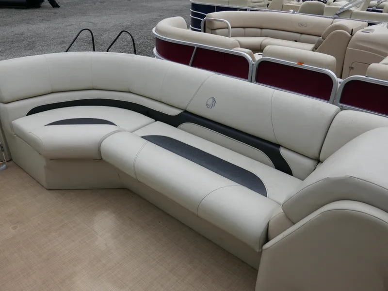 Slide: The Image of 2015 Lowe SS230 pontoon boat interior with beige seating and black accents. - 6