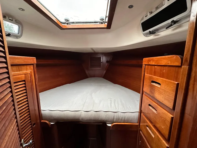 Slide: The Image of Cozy cabin interior of 1981 Tartan 37 sloop with wooden finish and overhead hatch. - 14