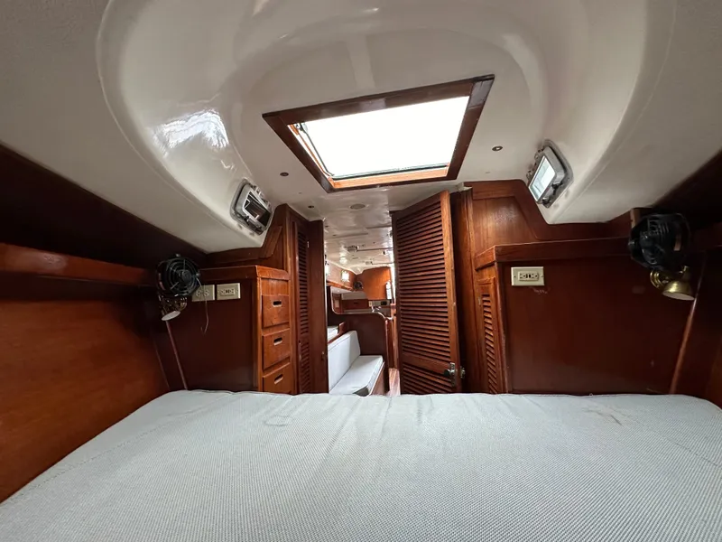 Slide: The Image of Interior of 1981 Tartan 37 sloop with wooden cabinetry and skylight. - 15