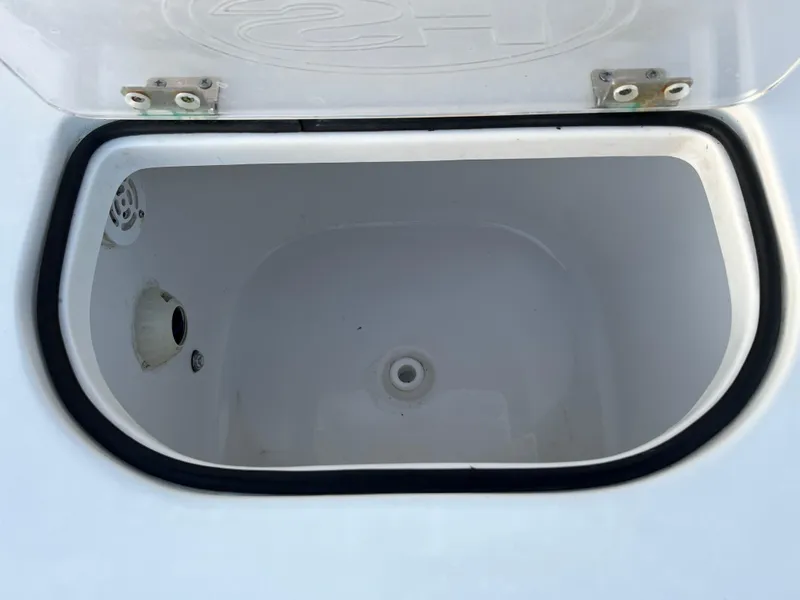 Slide: The Image of Open storage compartment on 2024 Sea Hunt Ultra 239 SE boat. - 14