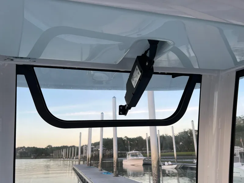 Slide: The Image of 2024 Sea Hunt Ultra 239 SE boat windshield view at marina. - 22