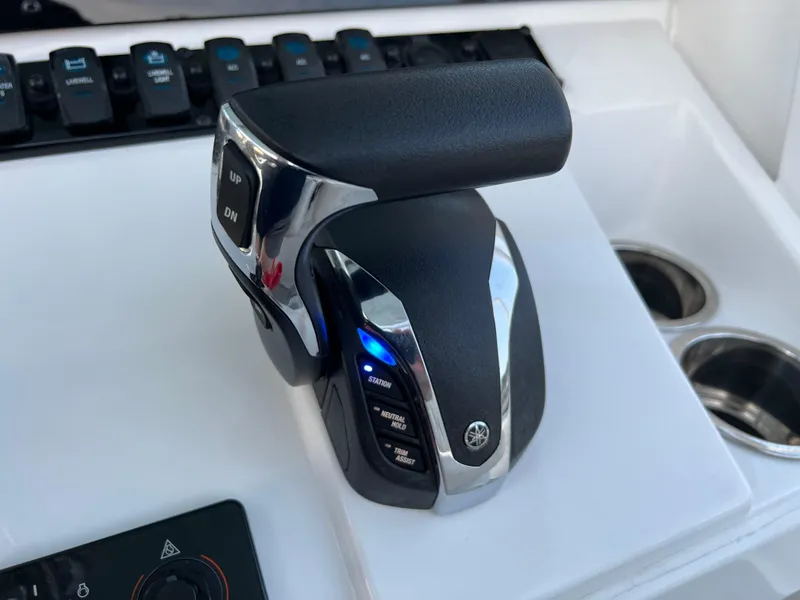 Slide: The Image of Throttle control of 2024 Sea Hunt Ultra 239 SE boat, featuring modern design and functionality. - 24