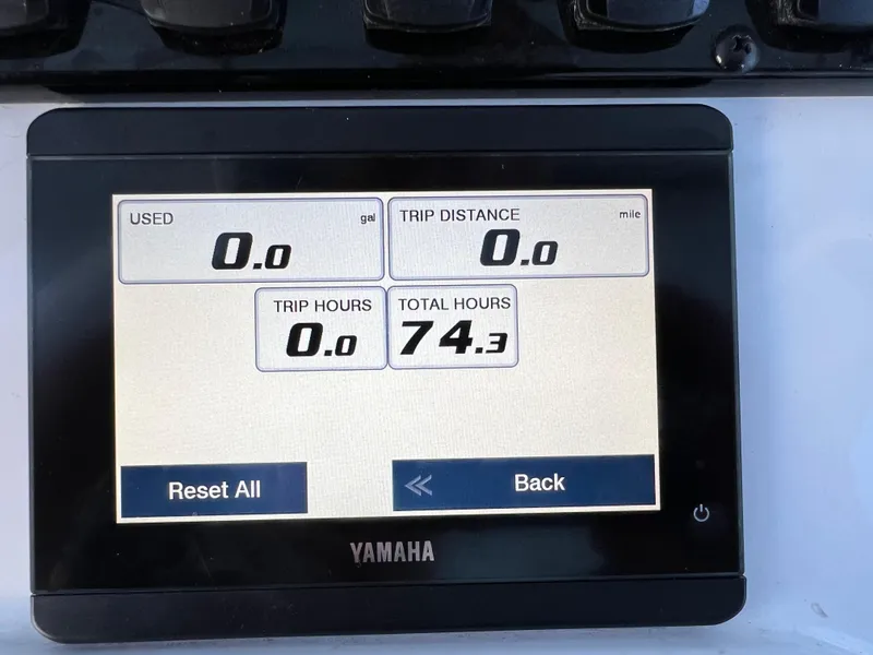 Slide: The Image of Yamaha display showing 74.3 total hours on a 2024 Sea Hunt Ultra 239 SE boat. - 27