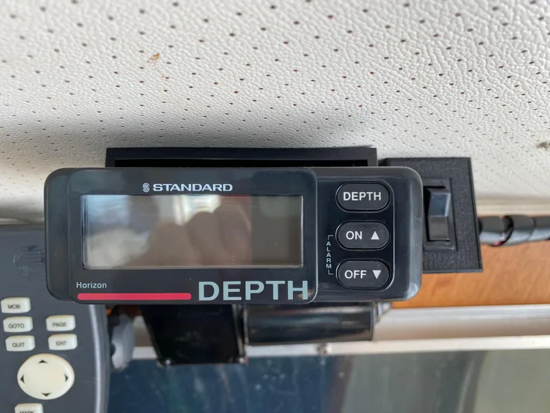 Slide: The Image of Depth gauge on 1984 Tollycraft 34 Convertible Sedan boat dashboard. - 24