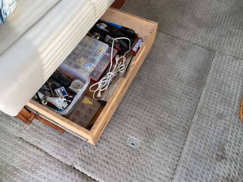 Slide: The Image of Open drawer with assorted tools and supplies on a 1984 Tollycraft 34 Convertible Sedan. - 27