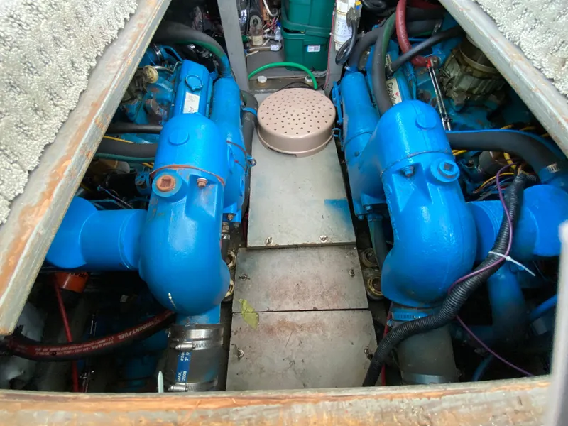 Slide: The Image of Engine compartment of a 1984 Tollycraft 34 Convertible Sedan with blue machinery. - 29