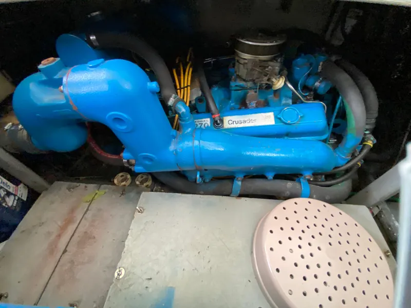 Slide: The Image of 1984 Tollycraft 34 Convertible Sedan engine, featuring a blue Crusader motor. - 30