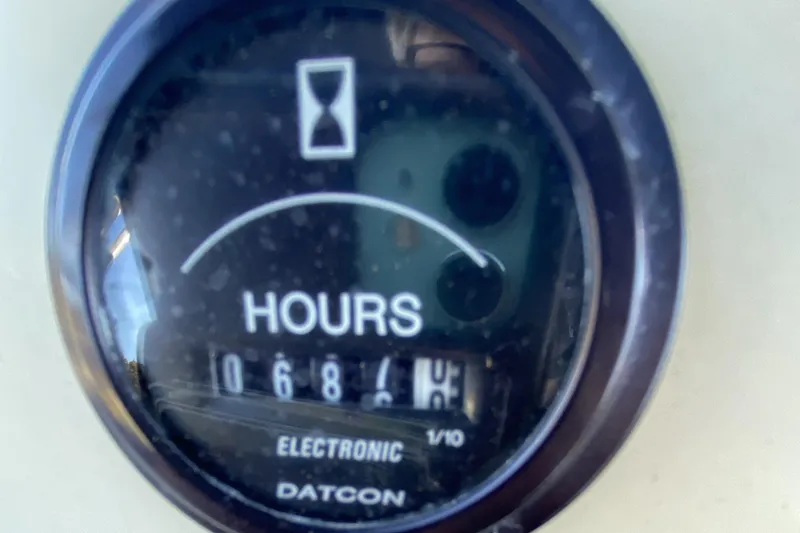 Slide: The Image of Hour meter on 1984 Tollycraft 34 Convertible Sedan, displaying 1068.4 hours. - 45