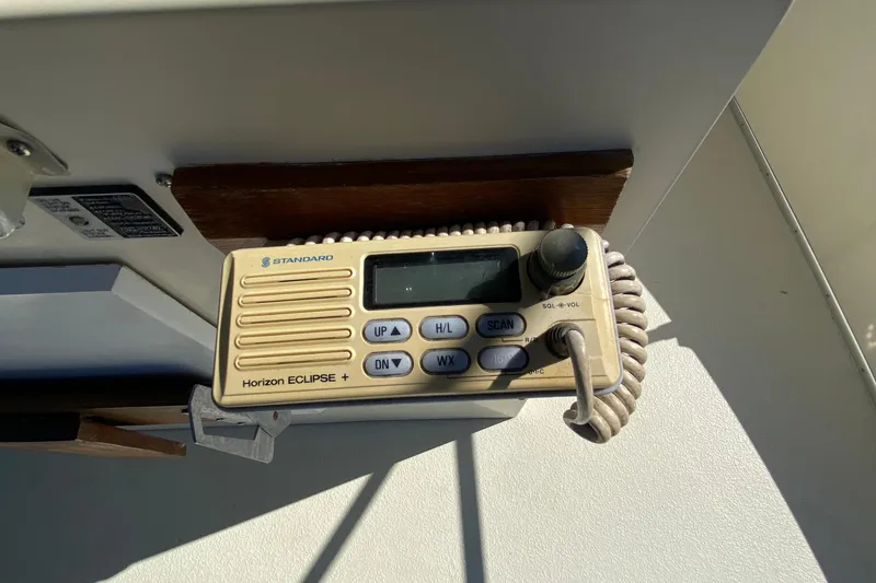 Slide: The Image of Standard Horizon Eclipse+ radio on 1984 Tollycraft 34 Convertible Sedan boat. - 48
