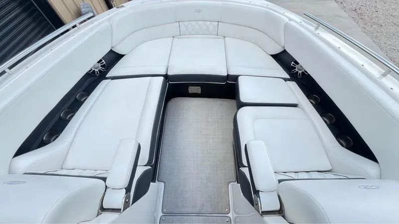 Slide: The Image of 2022 Regal 29 OBX boat interior with luxurious white seating and modern design. - 14