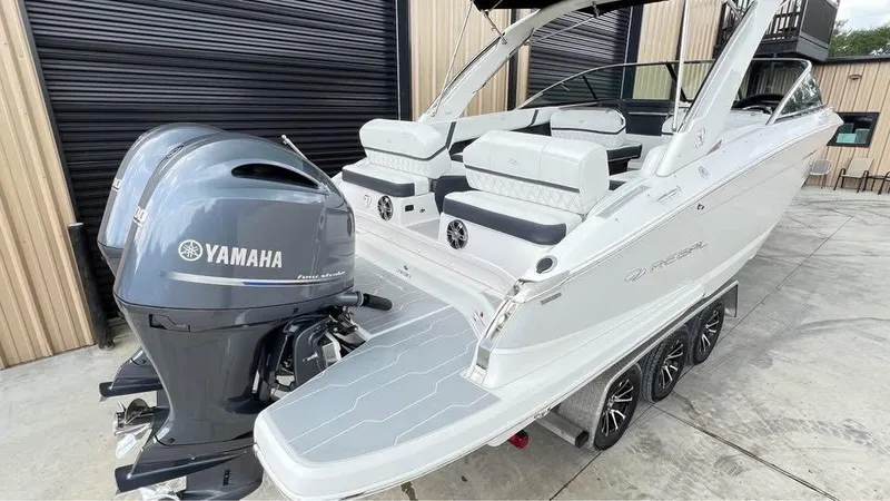 Slide: The Image of 2022 Regal 29 OBX boat with Yamaha outboard motor on trailer. - 16