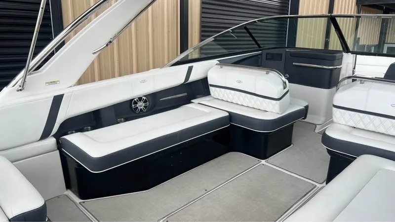 Slide: The Image of 2022 Regal 29 OBX boat interior with luxurious seating and modern design. - 6