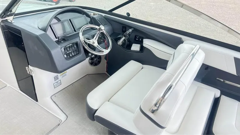 Slide: The Image of 2022 Regal 29 OBX boat interior with modern dashboard and steering wheel. - 8