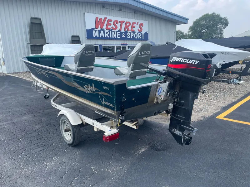 Slide: The Image of 2003 Lund 1650-V Rebel Tiller boat with Mercury engine at Westre's Marine & Sport. - 13