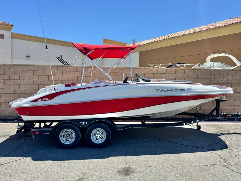 The Image of 2018 Tracker TAHOE 215 XI boat with red and white design on trailer. - 0