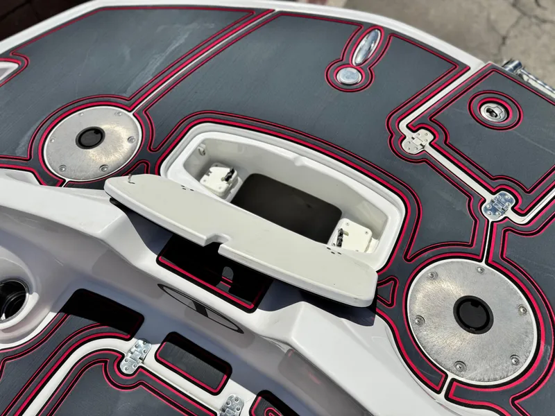 Slide: The Image of 2018 Tracker TAHOE 215 XI boat deck with red and gray design details. - 10