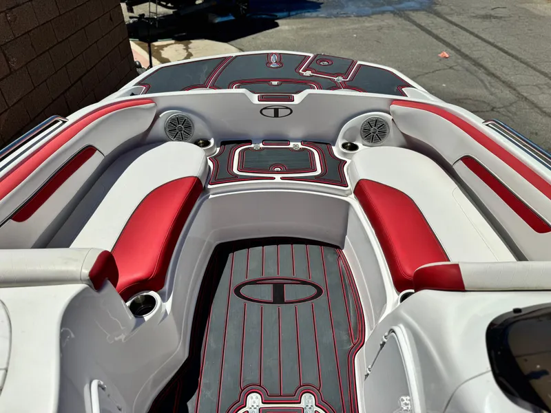 Slide: The Image of 2018 Tracker TAHOE 215 XI boat interior with red and white seating and speakers. - 11