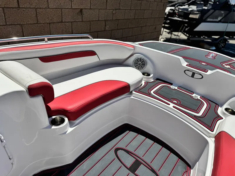 Slide: The Image of 2018 Tracker TAHOE 215 XI boat interior with red and white seating and cup holders. - 12