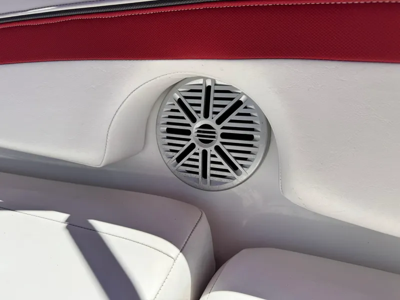 Slide: The Image of Speaker on 2018 Tracker TAHOE 215 XI boat with red and white interior. - 21