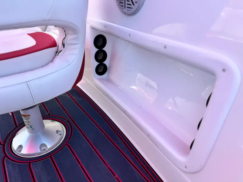 Slide: The Image of 2018 Tracker TAHOE 215 XI boat interior with white and red seating, black floor accents. - 25